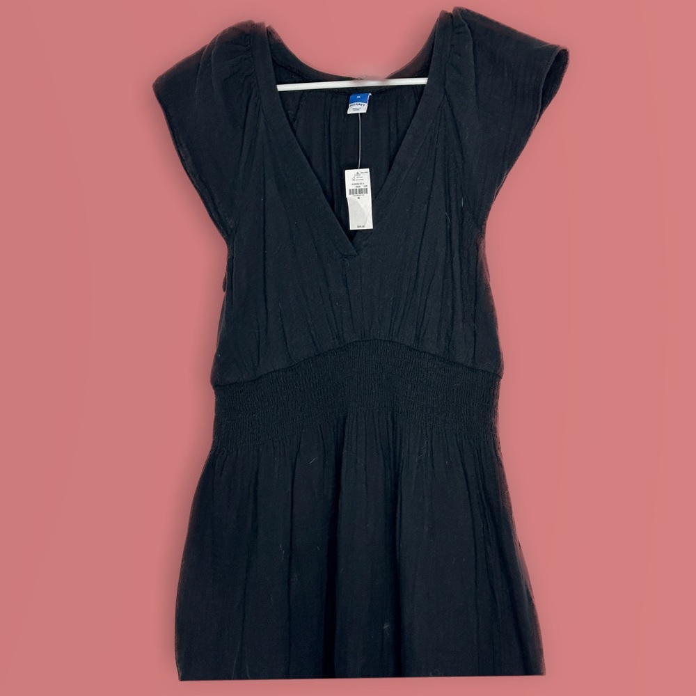 Woman’s black dress with shoulder straps
